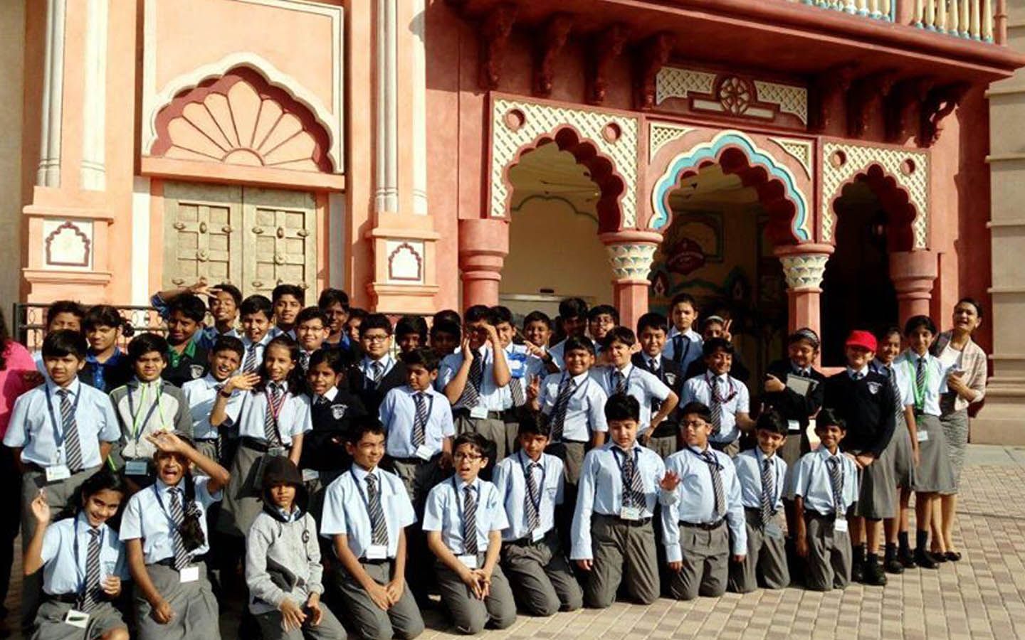 Students posing at one of the architectural brilliance at Bollywood Park