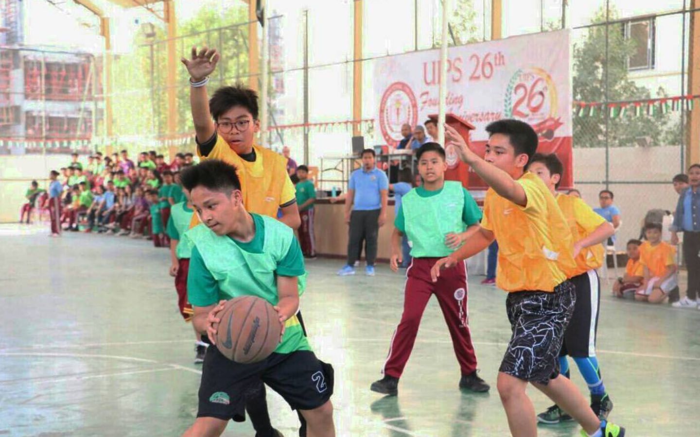 Students of United International Private School playing basketball